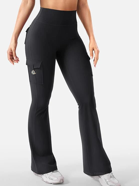A model wearing black high-waisted flared fitness pants with a cargo pocket detail.
