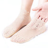 Pair of light pink lace mesh ankle socks displayed on a white background.