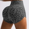 A woman is wearing leopard print high-waist seamless shorts.