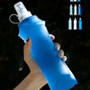 A hand holds a blue collapsible silicone hydration flask with multiple silicone straws and caps.