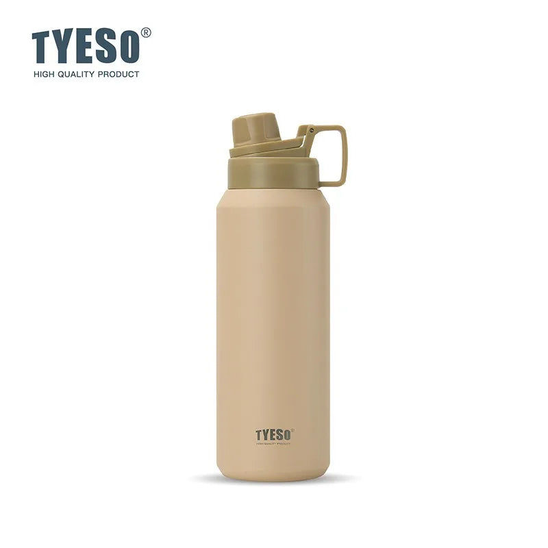 Tasse isotherme en acier inoxydable beige avec un couvercle vert clair.