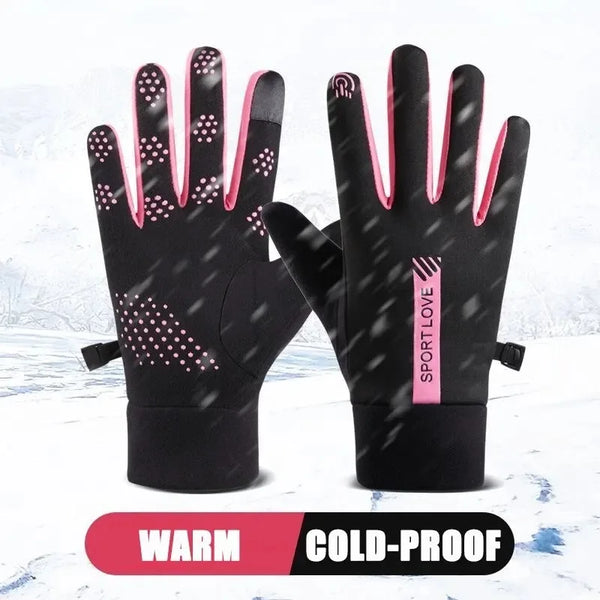 A pair of black thermal cycling and running gloves with pink accents shown against a snowy background.