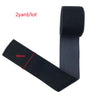 Black stretch velvet elastic headband shown flat and rolled, with a measurement line marked.