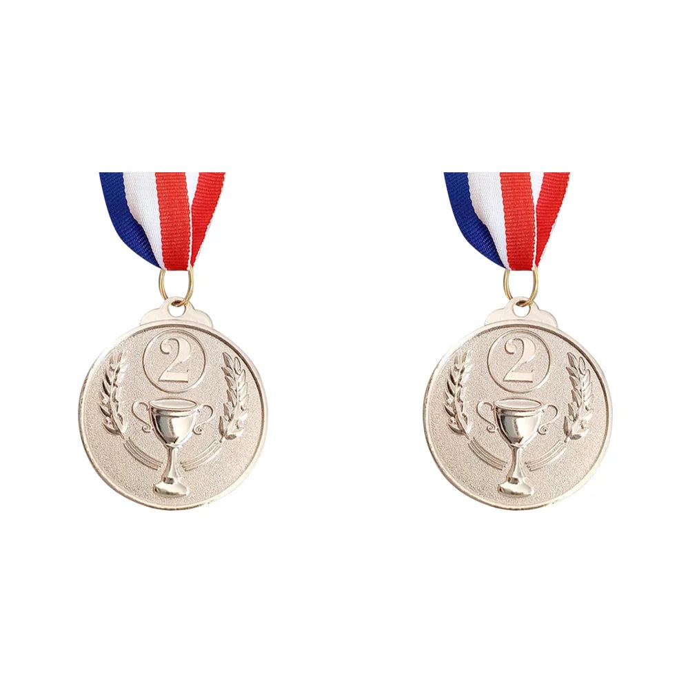 Two gold sports achievement medals hanging from ribbons with red, white, and blue stripes.