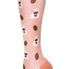 A close-up of a light pink compression sock with small heart patterns and white stripes.