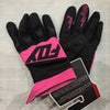 A pair of black and pink durable motorcycle off-road riding gloves are displayed on a light background.