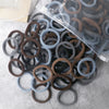 A pile of 50 pieces of mixed color elastic hair bands in various shades of brown and gray.
