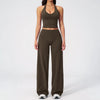 A woman wearing a dark olive green women's premium fitness tracksuit top and matching pants.