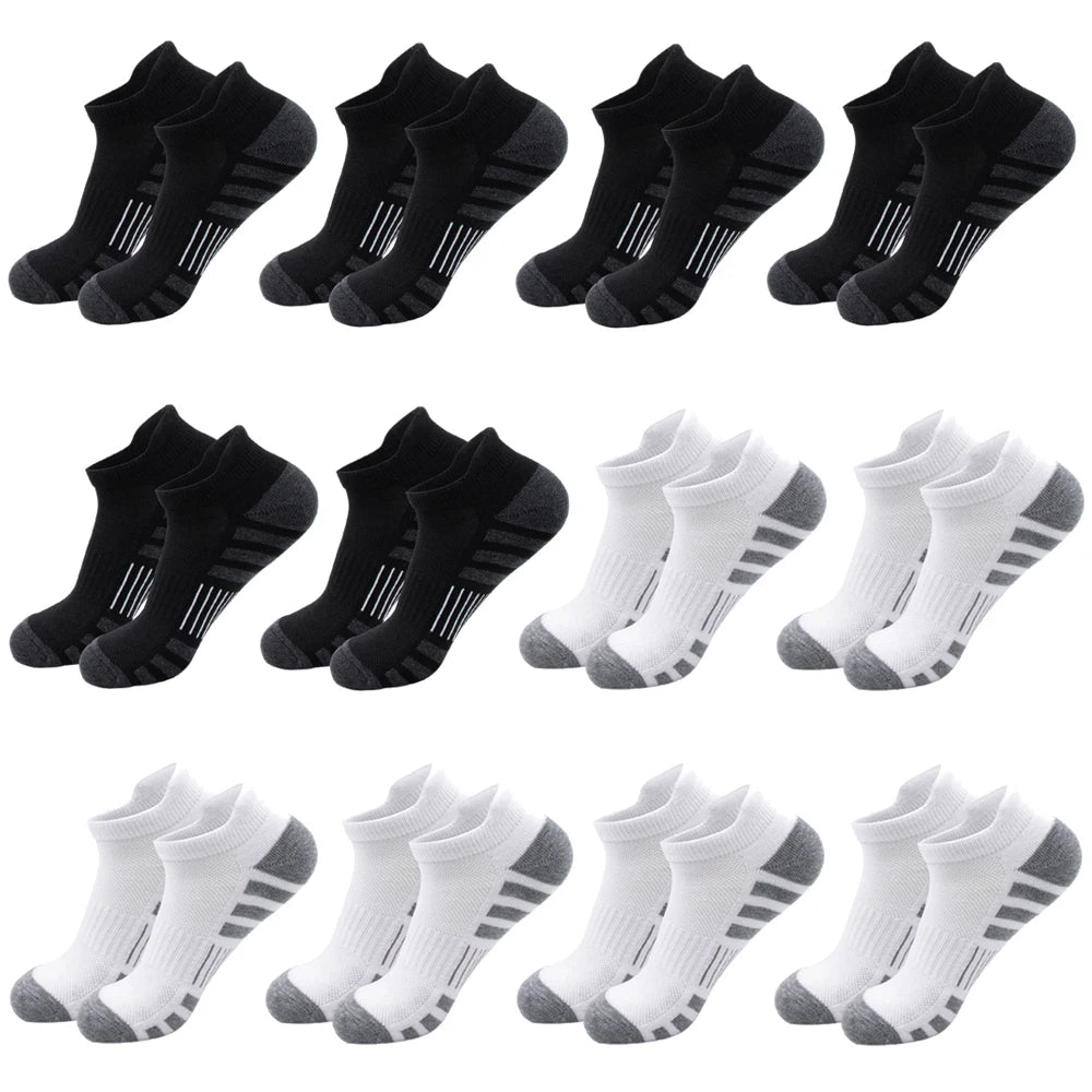A collection of black and gray athletic running socks for men and women shown from various angles.