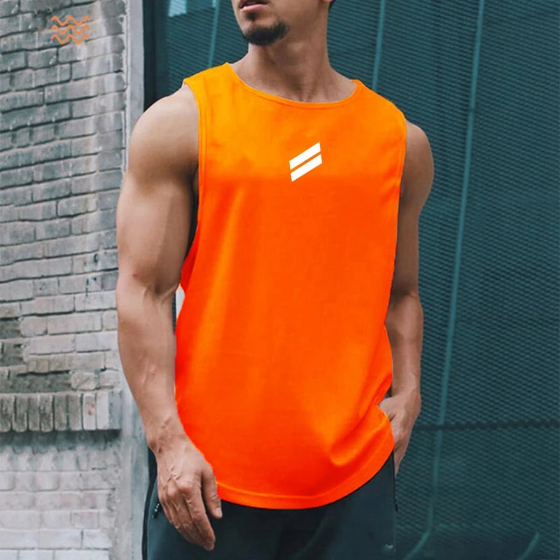 A muscular man wearing a bright orange sleeveless sports tank top with a white logo, standing outdoors.