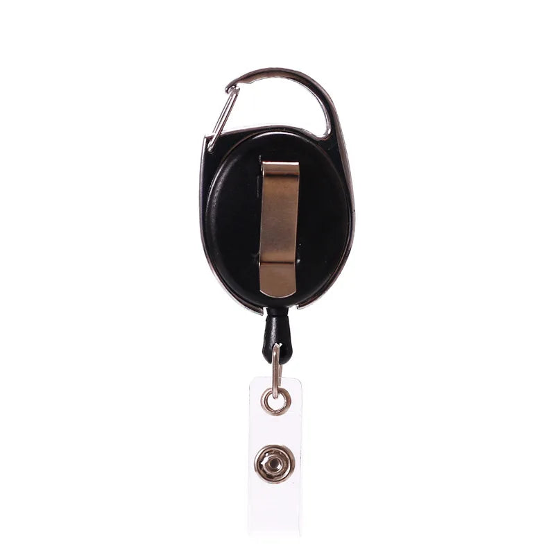 Black retractable ID badge reel keychain with a gold-colored pull tab and keyring.