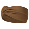 A brown knitted elastic sports headband is tightly knotted and shown from the side.