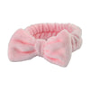 Pink microfiber spa headband and wristband set with a fluffy texture