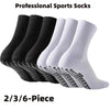 Un ensemble de chaussettes de sport professionnelles noir et blanc avec adhérence silicone pour football.