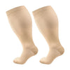 A pair of beige compression socks shown from the side.