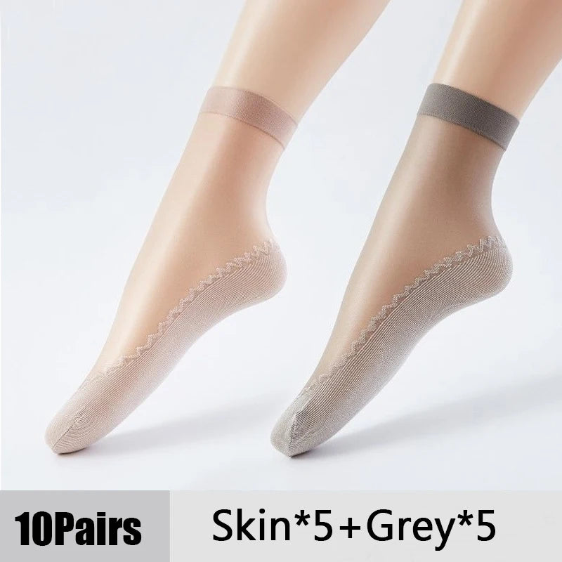 Ten pairs of ultra-thin breathable ankle socks in skin tone and grey color shown on a foot.