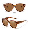 Front view of COL.10 round sunglasses with brown tortoiseshell frames and amber lenses.