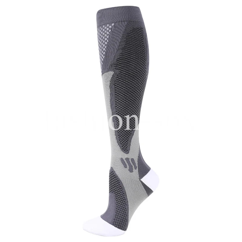 A close-up view of a gray compression sock with a white toe and heel, designed for veins and pregnancy support.