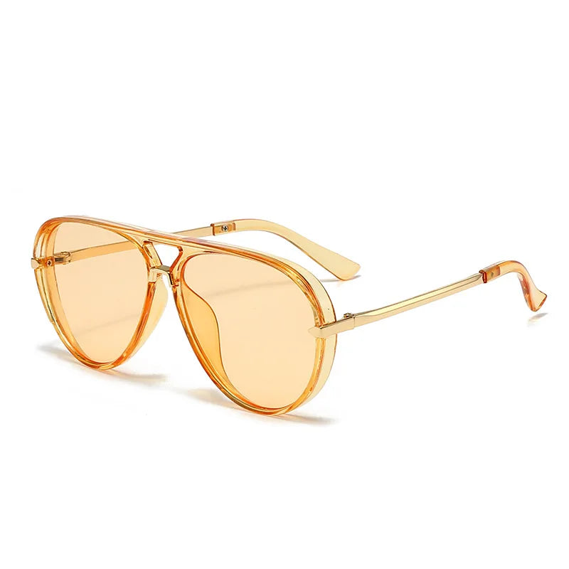 A pair of gold-toned fashion protective sunglasses with clear lenses and thin metal arms.