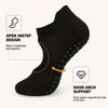 Black non-slip pilates yoga socks showing an open instep design and arch support features.