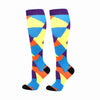 A pair of colorful compression elastic socks featuring a geometric pattern of blue, yellow, orange, and purple.