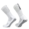 A pair of white honeycomb grip football socks shown from the side.