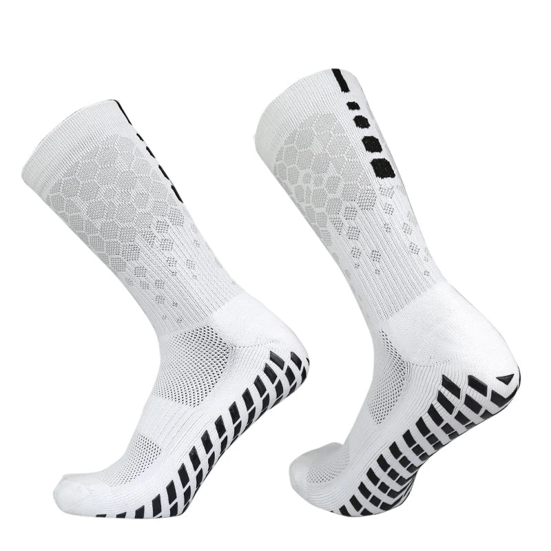 A pair of white honeycomb grip football socks shown from the side.