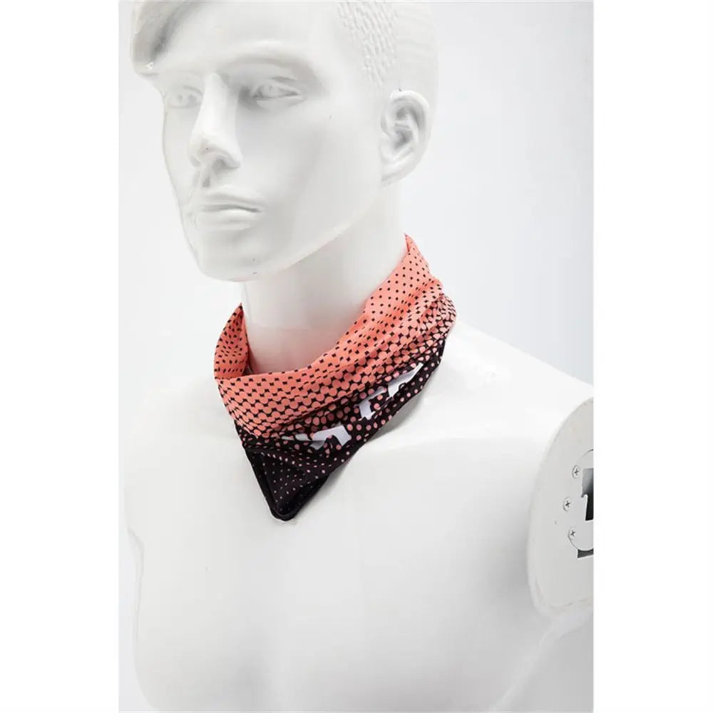 A woman wearing an orange and black patterned breathable full face sun protection mask displayed on a white mannequin.