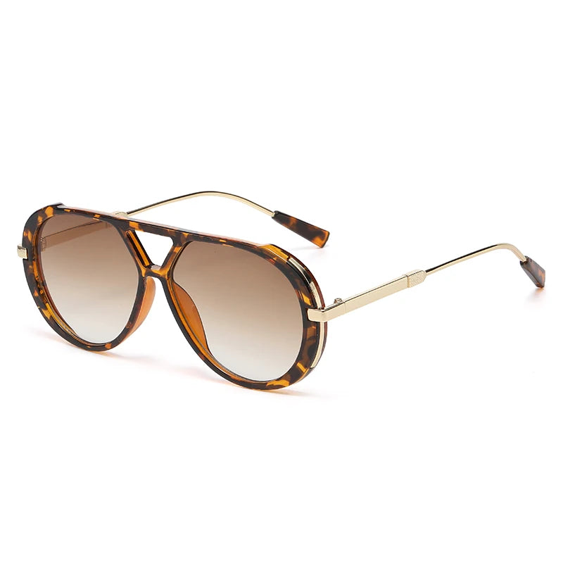 Vintage oversized designer sunglasses with brown leopard print frames and tinted lenses