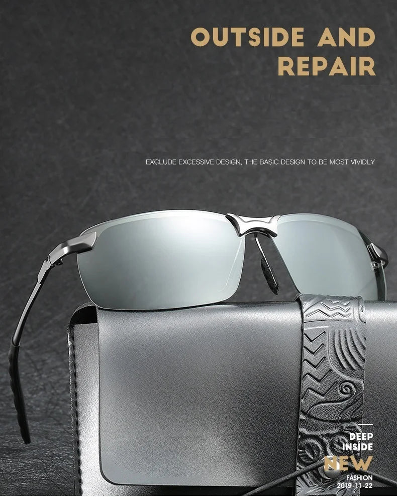 Primer plano de gafas de sol polarizadas fotocromáticas plateadas sobre una superficie gris oscuro.