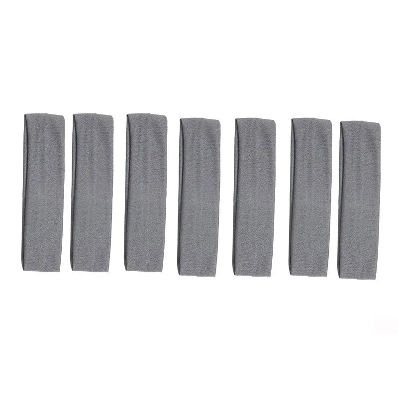 A row of nine gray stretchy sports headbands displayed horizontally.