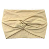 A beige women's elastic sports headband folded and displayed flat.