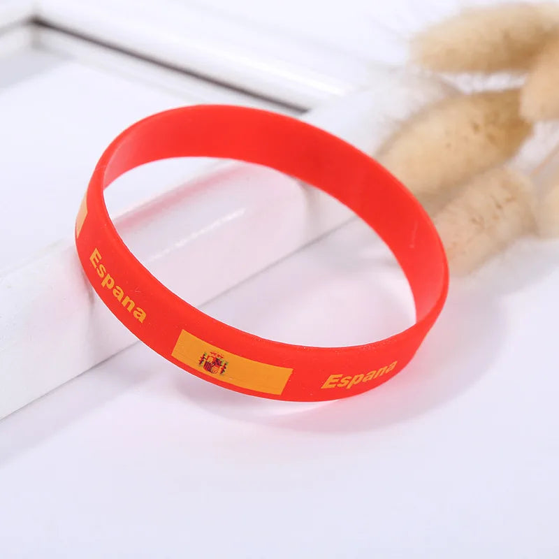 Red silicone wristband with the flag of Spain printed on it