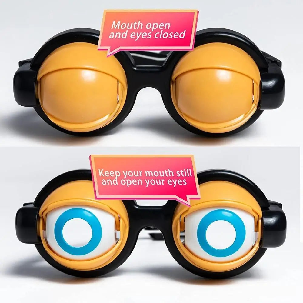 A pair of black novelty glasses with yellow lenses and a pink sign instructing the user to keep their mouth still and open th