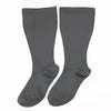 A pair of charcoal gray compression socks for circulation and support.