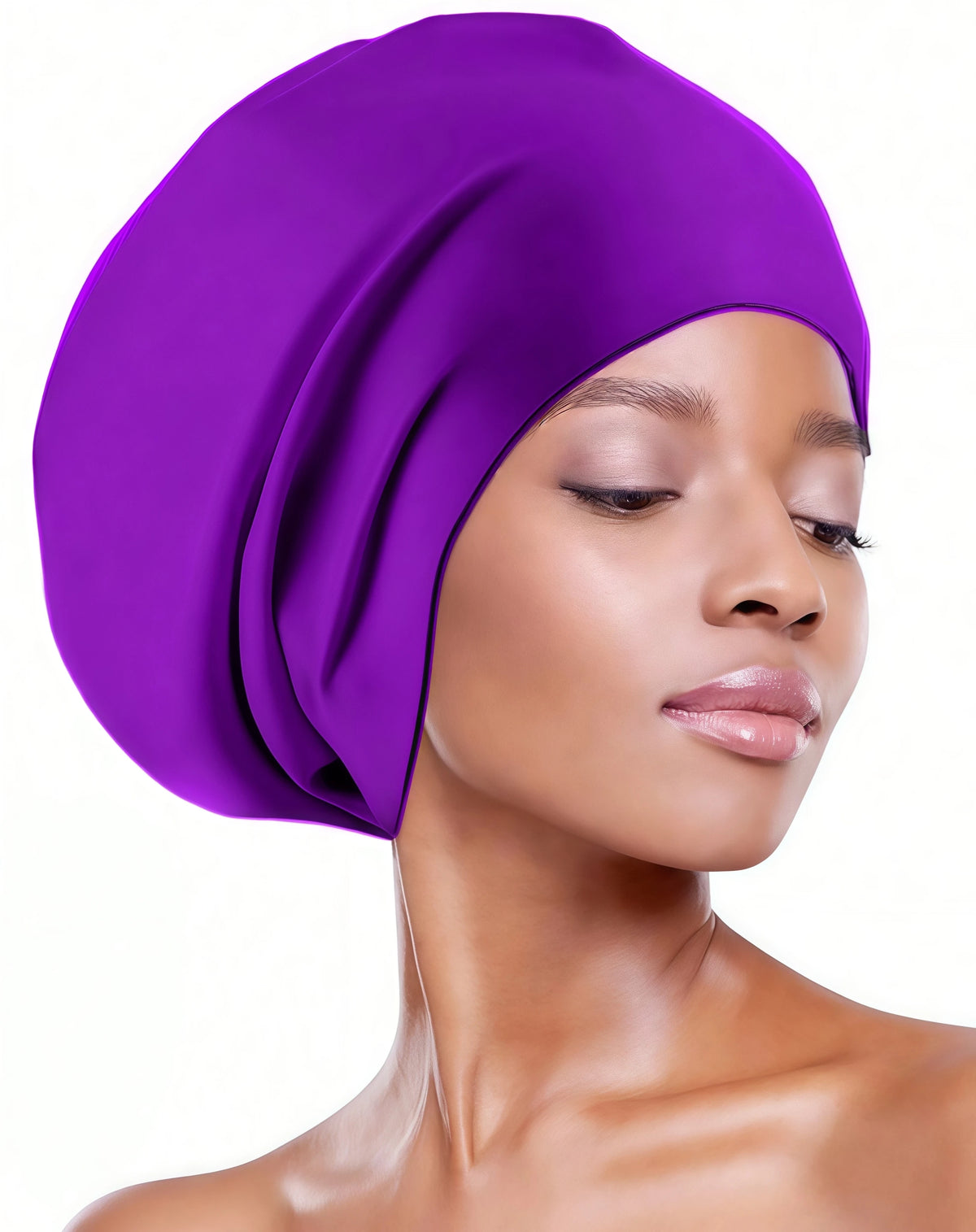 A close-up of a woman wearing a vibrant purple silicone swim cap for long hair.
