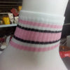 White fabric wristband with horizontal pink and black stripes
