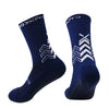 A pair of navy blue athletic sports socks with a chevron pattern.