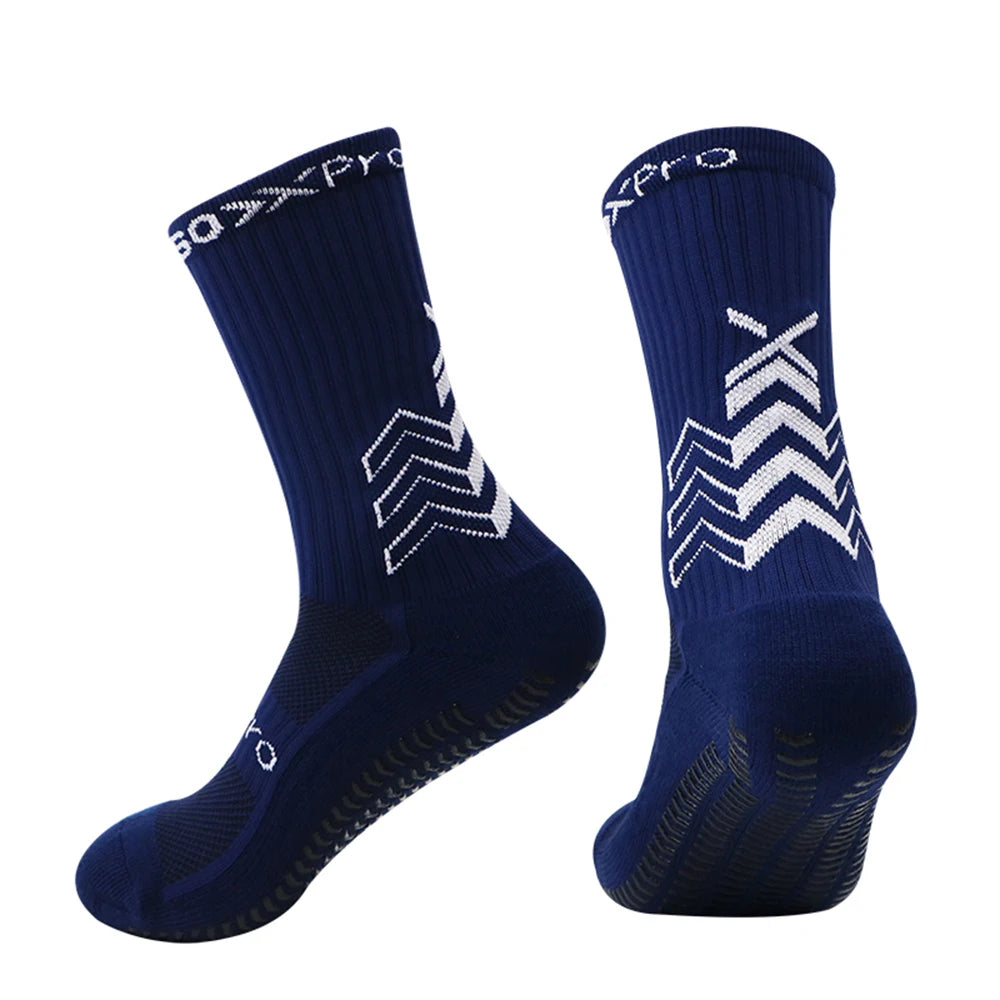 A pair of navy blue athletic sports socks with a chevron pattern.