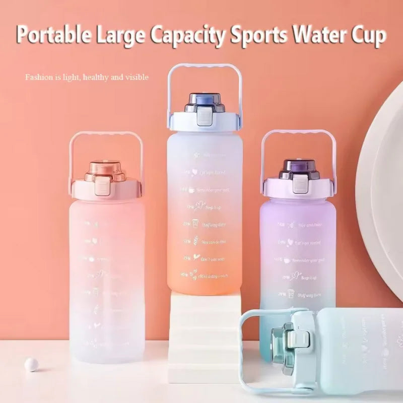A portable large capacity sports water cup in pink and purple colors with clear silicone lids