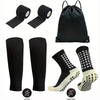 A set of black football gear including a sleeve, compression socks, and basketball socks.
