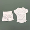 White seamless yoga set for women featuring a short sleeve top and workout leggings