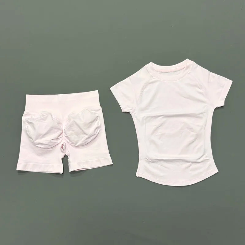 White seamless yoga set for women featuring a short sleeve top and workout leggings