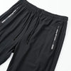 Black breathable men's casual jogger pants shown flat lay with a side pocket detail.