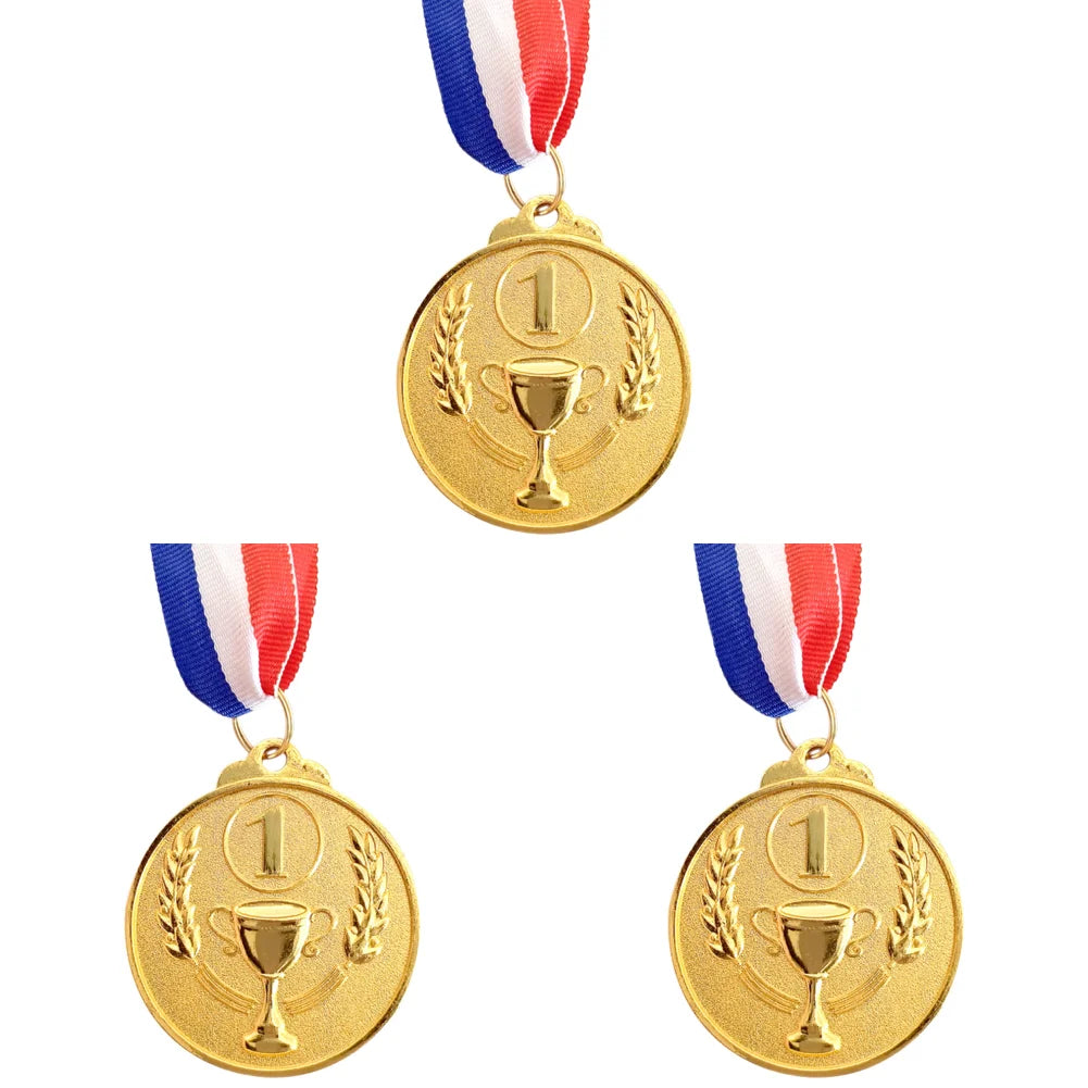 Three gold sports achievement medals with red white and blue ribbons hanging from a circular gold medal.