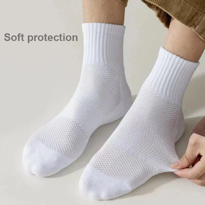 White breathable sports performance socks shown on a foot, emphasizing soft protection.