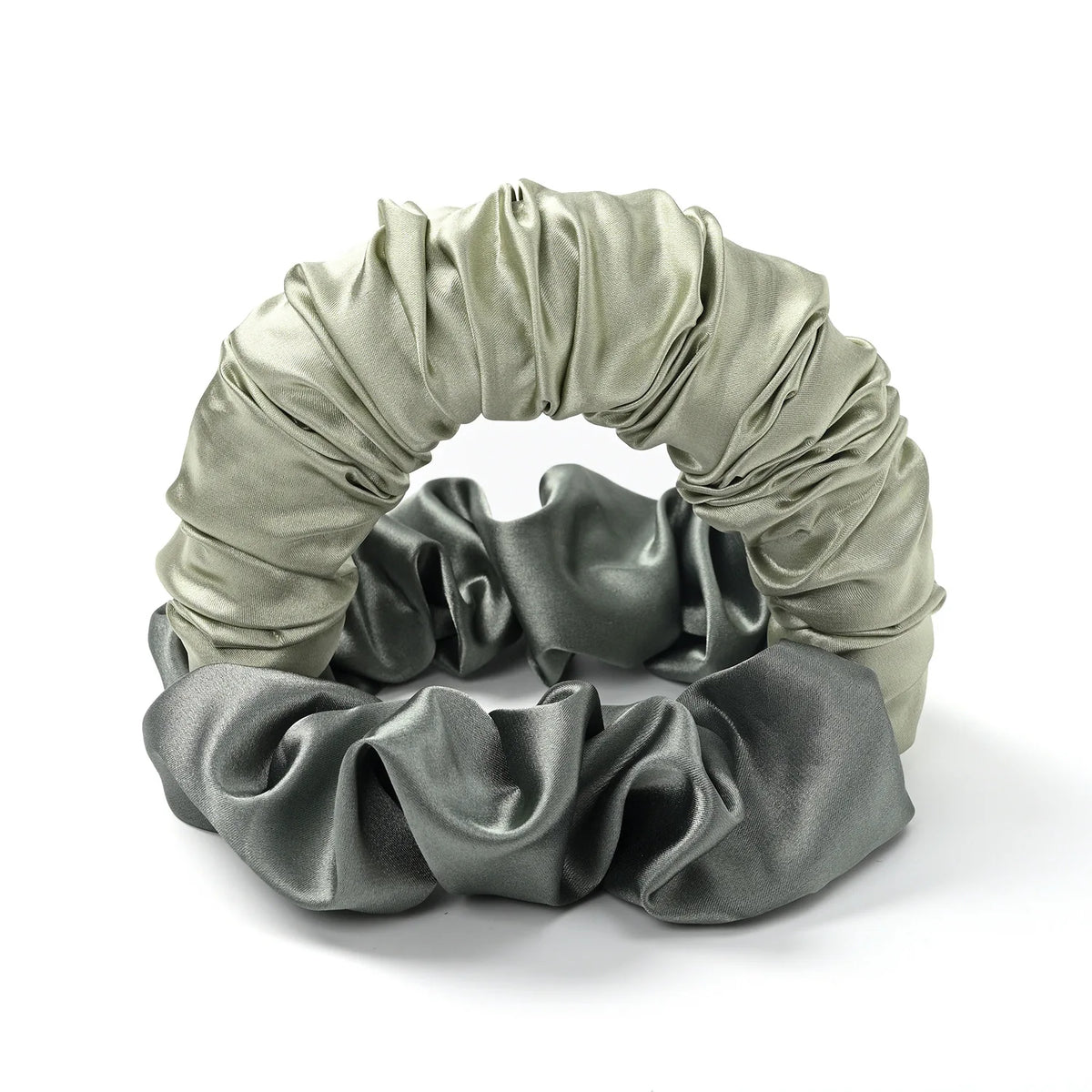 A gray satin heatless curling rod headband tied in a voluminous, ruched bow.