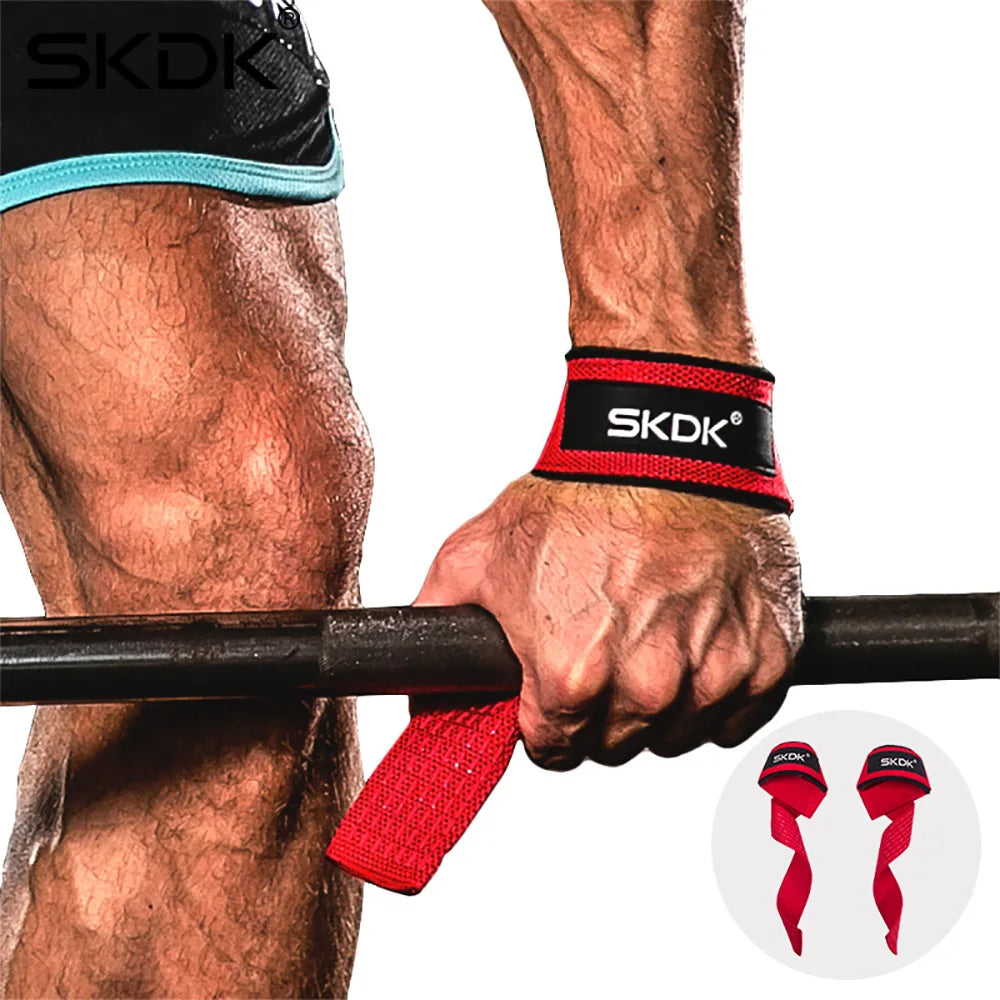 A close-up of a person gripping a barbell with red wrist straps, showing the SKDK brand logo.