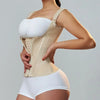 A woman wearing a beige adjustable body shaper corset vest top and matching white bottoms.