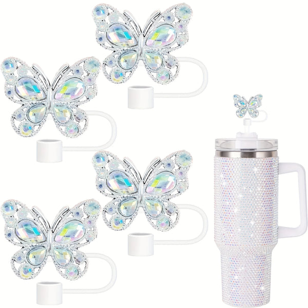 A set of four clear silicone butterfly straw toppers with white handles.